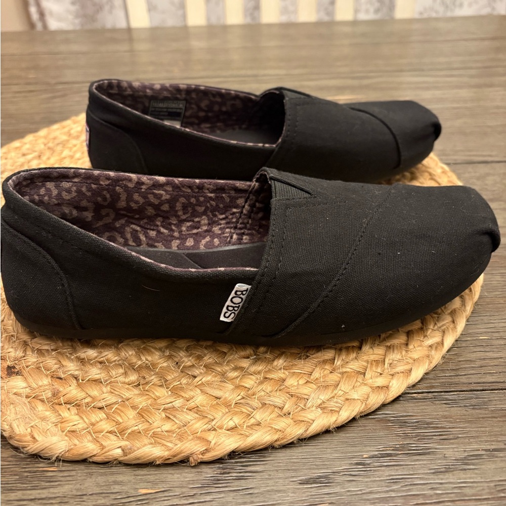 Black Slip-On Shoes by BOBS